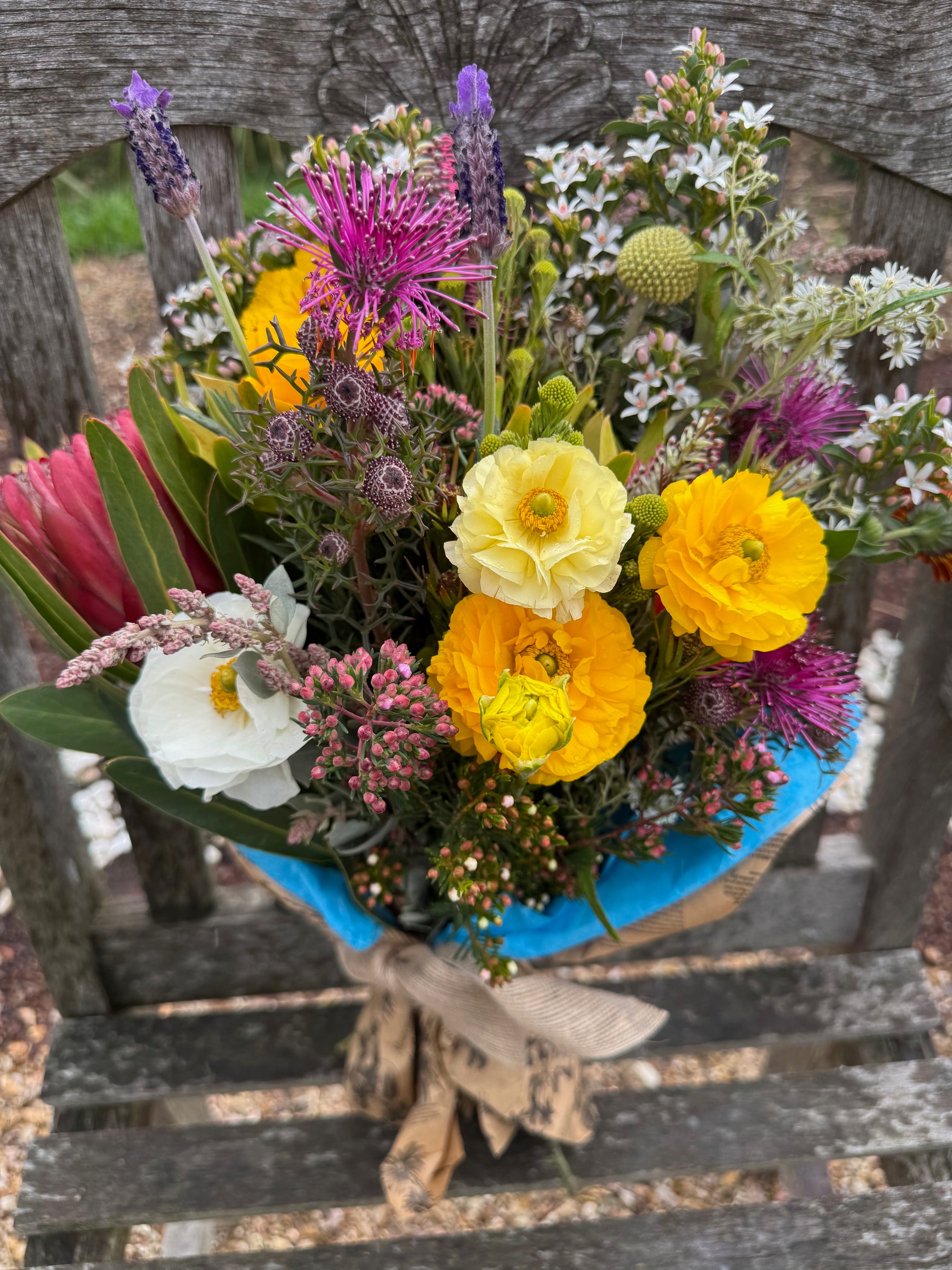 Organically grown seasonal fresh flowers in a wrapped bouquet